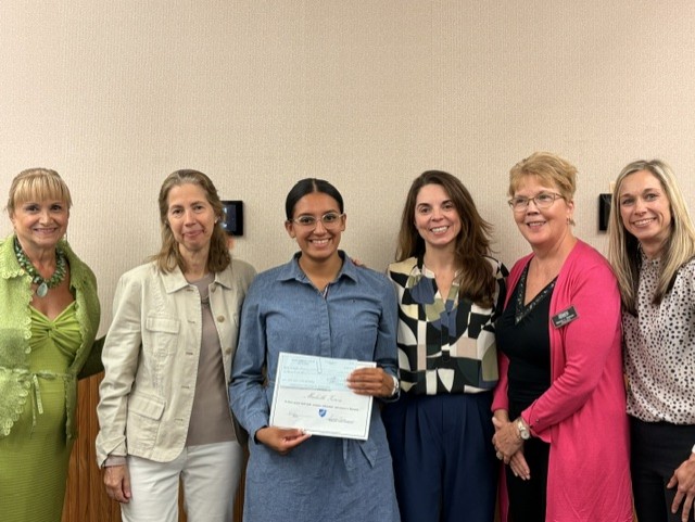 Michelle Zeron receiving her scholarship